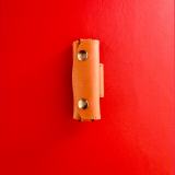 Max Capdebarthes . Tan leather pouch. Horizontal mount.